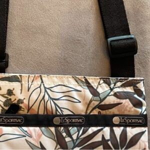 LeSportSac Crossbody Bag with Leaf Pattern of Blues Greens Pinks, multiple Zips